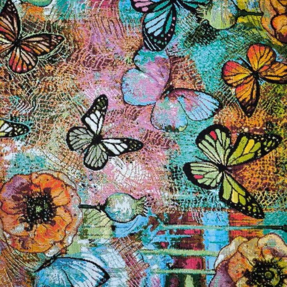 Tejido Jacquard AQUAMARINA con mariposas multicolor y fondo azul. Ancho 140