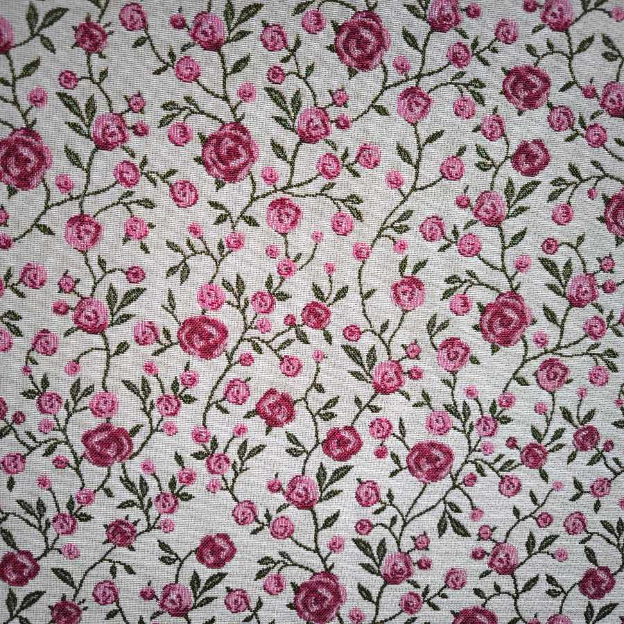 WINS jacquard fabric with pink flowers and green leaves. Width: 140 cm