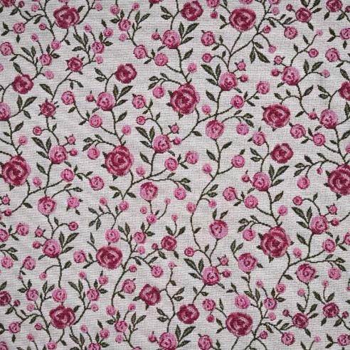 Tejido Jacquard WINS con flores rosas y hojitas verdes. Ancho 140